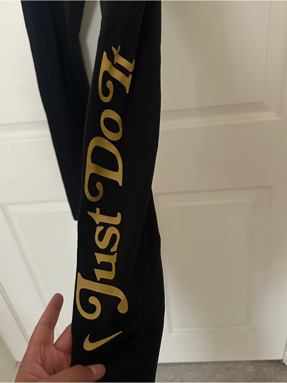 Nike Black Leggings with Gold Accent Script
